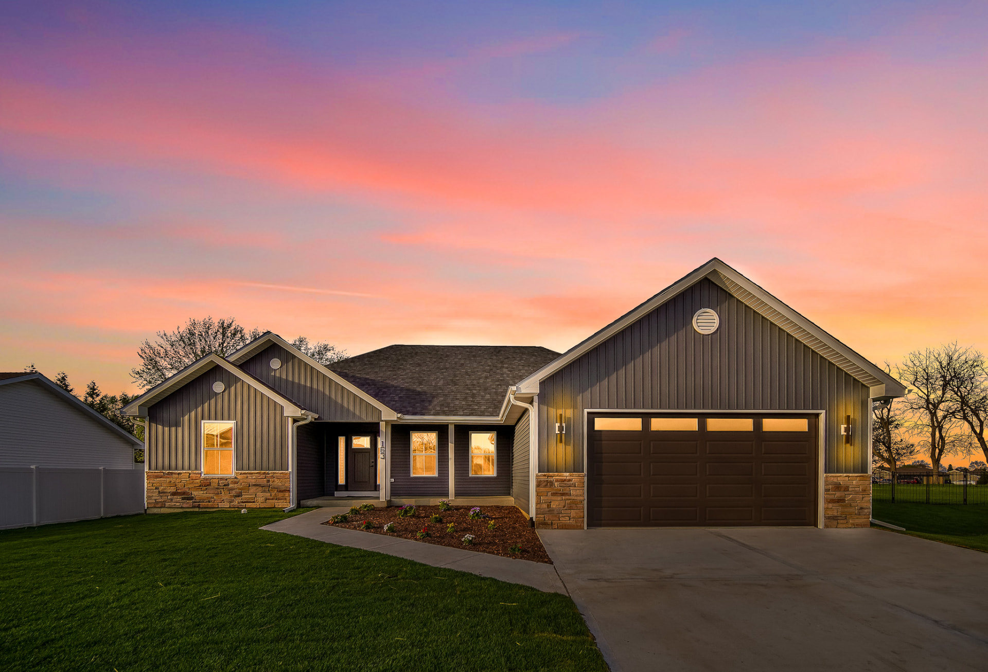 Twilight exterior of the Manteno, Illinois new construction spec home