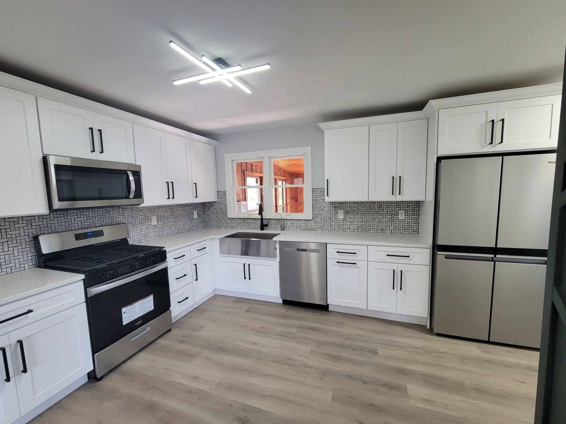 After: remodeled Mokena kitchen with white shaker cabinets and quartz counters